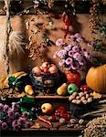 DISPLAY OF AUTUMN HARVEST FRUITS GRAINS AND FLOWERS