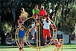 MULTI ETHNIC BOYS AND GIRLS ON PLAYGROUND