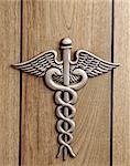 CADUCEUS AN INSIGNIA OF HERMES WINGED STAFF TWINED WITH SERPENTS NOW THE SYMBOL OF THE MEDICAL PROFESSION