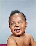 1960s AFRICAN-AMERICAN BABY BOY SMILING PORTRAIT