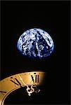 EARTH AND CLOCK FACE AT 11:57