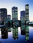 DOWNTOWN LOS ANGELES SKYLINE AT TWILIGHT SKYSCRAPERS REFLECTED IN WATER