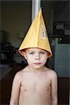 Portrait of Little Boy Wearing Envelope as a Hat
