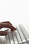 Man Typing on Keyboard