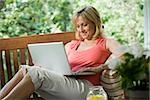 Woman outdoors with laptop