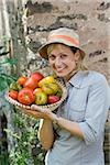 Woman with bowl of tomatoes