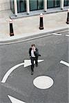 Elevated view of a businessman crossing the street