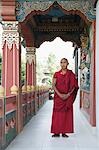 Monk standing in a temple, Bhutan Temple, Bodhgaya, Gaya, Bihar, India