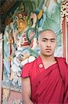 Monk standing in a temple, Bhutan Temple, Bodhgaya, Gaya, Bihar, India