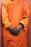 Monk standing with his hands clasped, Bodhgaya, Gaya, Bihar, India