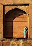 Woman leaning against the wall of a mausoleum, Taj Mahal, Agra, Uttar Pradesh, India