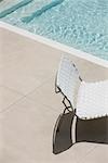 Chair at edge of shallow pool