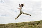 Woman jumping, midair