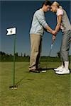 Young couple on golf course
