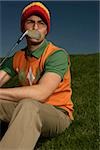 Young man wearing beanie on golf course