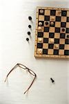 Chess Board and Glasses standing on Table