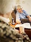 Elderly Couple in Retirement Home Working on Crossword Puzzle