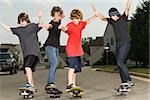 Four boys skateboarding