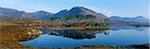 Reflection of trees and mountains in a lake, Derryclare Lough, Twelve Bens, Connemara, County Galway, Republic Of Ireland