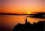 Angler am Sonnenuntergang, Roaring Wasser Bay, Co. Cork, Irland