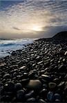 Doolin, County Clare, Ireland; Pebble beach at sunset