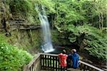 Co Sligo, Ireland; Tourists admiring Glencar waterfall from walkway