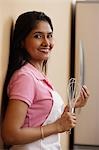 Indian woman smiling in the kitchen