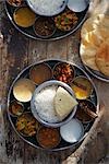 Thali, Rasam, Chana Masala, Kadai Bhindi, Mixed Vegetable Curry, Sambhar, Saag Paneer, Payasam, and Mixed Pickle