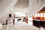 Room Attendant Making Bed, Soneva Gili Resort, Lankanfushi Island, North Male Atoll, Maldives