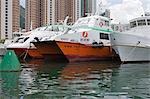 Boats at Shaukeiwan with condominiums in background, Hong Kong