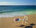 White chair and table at beach, Hawaii, USA