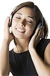 Woman listening to music and smiling
