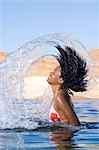 Woman splashing in water