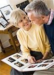 Mature couple looking at photo album