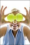 Frau mit Tennis Kugel-Augen