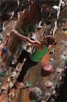 USA, Utah, Sandy, young woman on indoor climbing wall