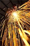 USA, Utah, Orem, sparks from man welding metal