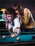 USA, Utah, American Fork, young couple playing pool