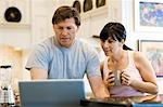 USA, Utah, Alpine, couple standing and looking at laptop