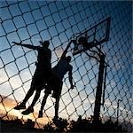 USA, Utah, Salt Lake City, two young men playing street basketball, low angle view