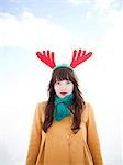 USA, Utah, Orem, young woman wearing reindeer horns, portrait