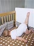 USA, Utah, Provo, Baby boy (18-23 months) lying in crib