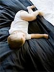 USA, Utah, Provo, Baby boy (18-23 months) asleep on bed