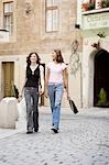 Two young women with shopping bags