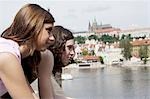 Two women talking by the water