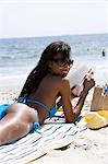 Woman reading at the beach