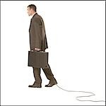 Businessman with briefcase and cable