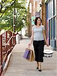 Woman with shopping bags on the street