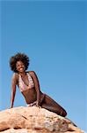 Woman on large boulder