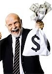 Portrait of businessman holding money bag